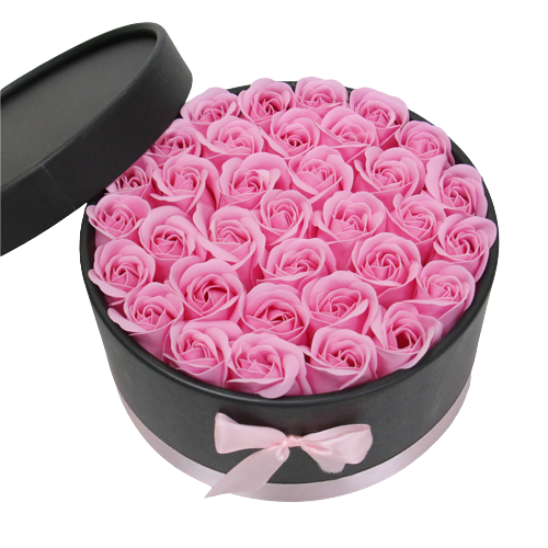 Exquisite Dekobox mit kunstvoll gefertigten pinken Seidenrosen in elegantem Design